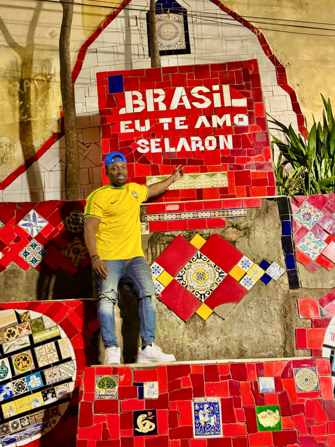 Koby beside colorful tilework in Rio, Brazil